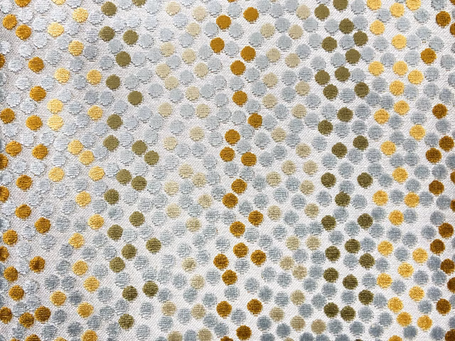Pale grey velvet with small ochre, olive and blue-grey rounded spots