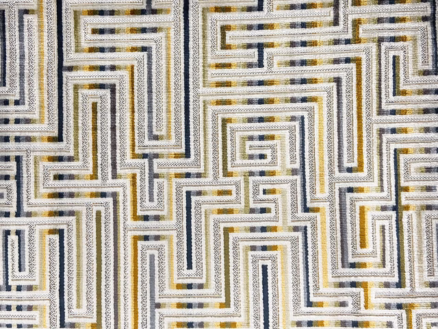 Cream velvet with charcoal, grey and ochre interlocking maze lines