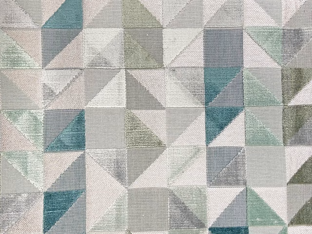 Mist-grey geometric velvet with sage, teal and blush triangular patchwork