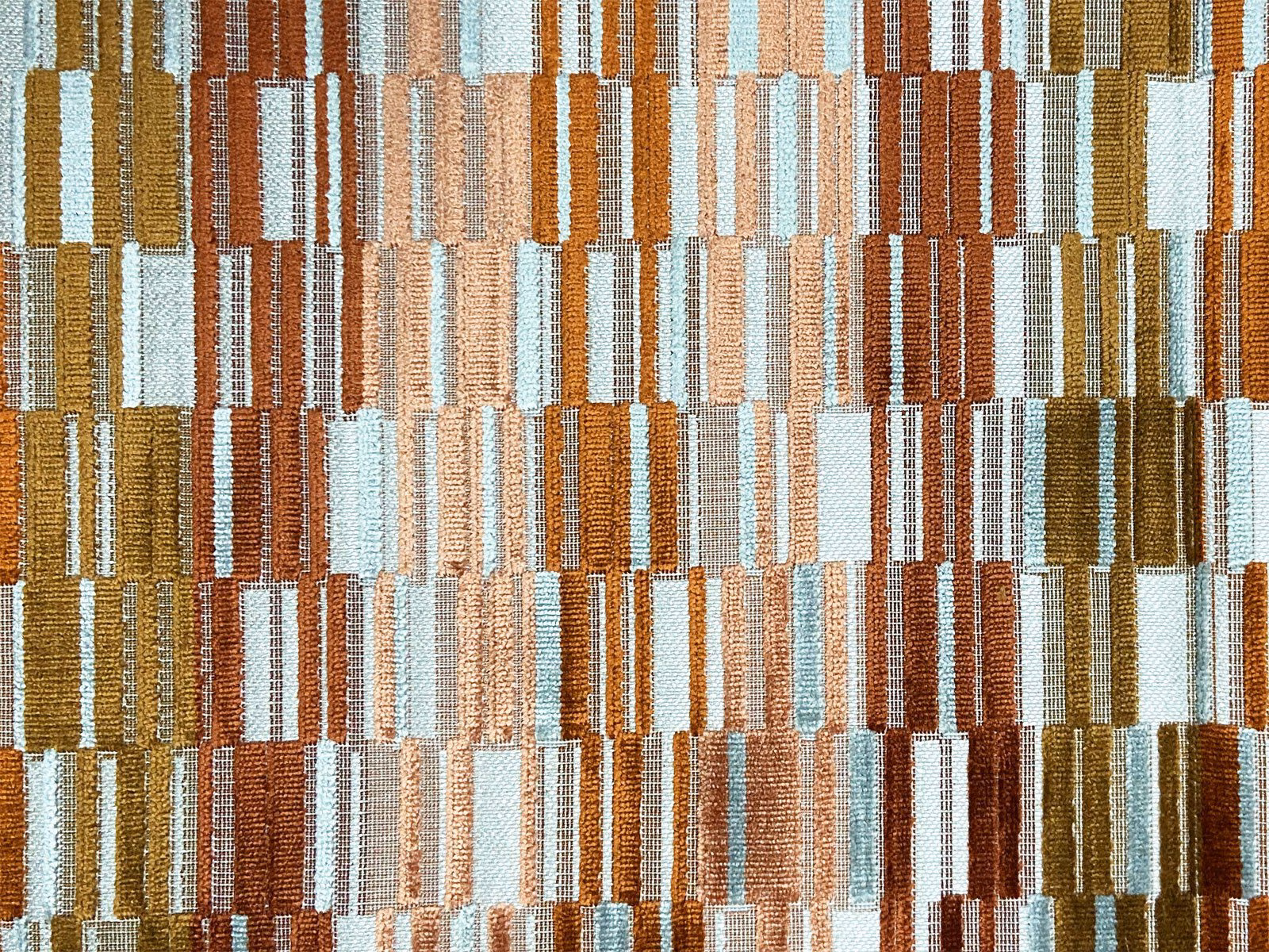 Textured multicolour velvet with stacked rust, ochre, cream and pale blue rectangular blocks