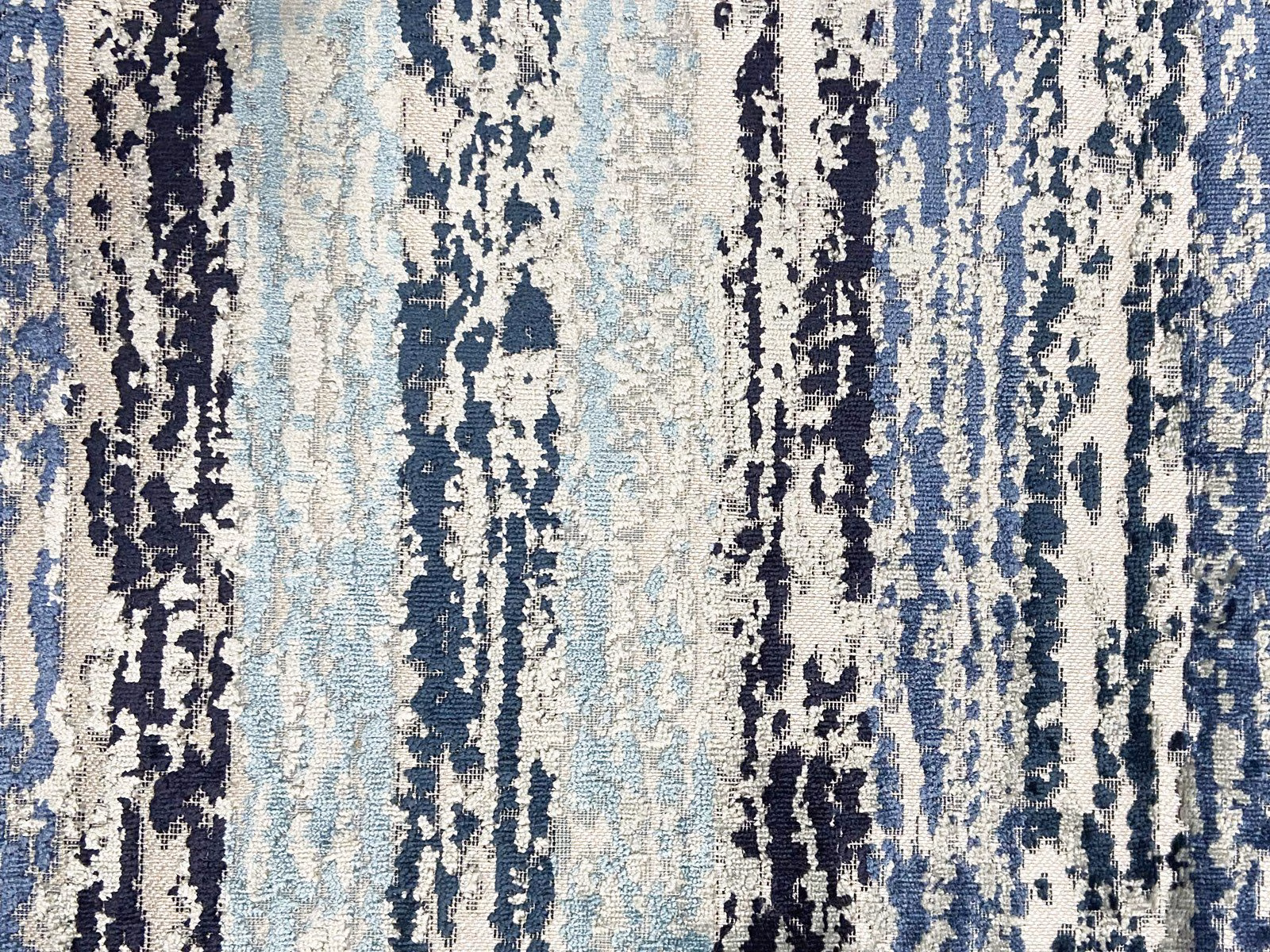 Icy blue velvet with navy and cream distressed vertical striations and plush texture