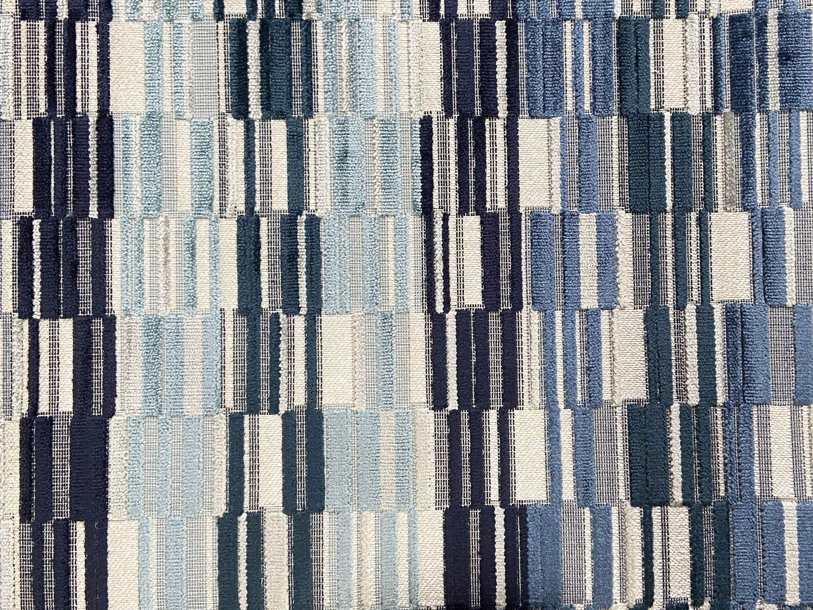 Blue and ivory velvet with navy rectangular blocks and a softly ridged surface