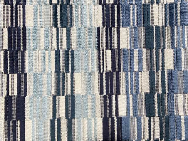 Blue and ivory velvet with navy rectangular blocks and a softly ridged surface