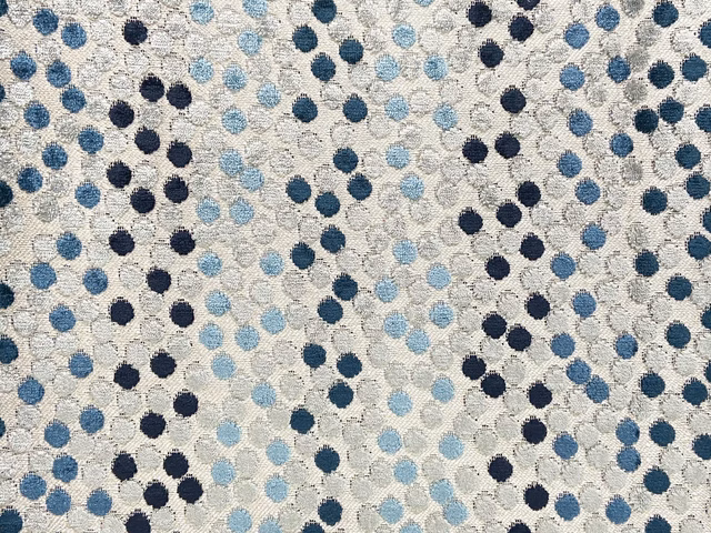 Cream velvet with scattered navy, denim and pale blue circular motifs