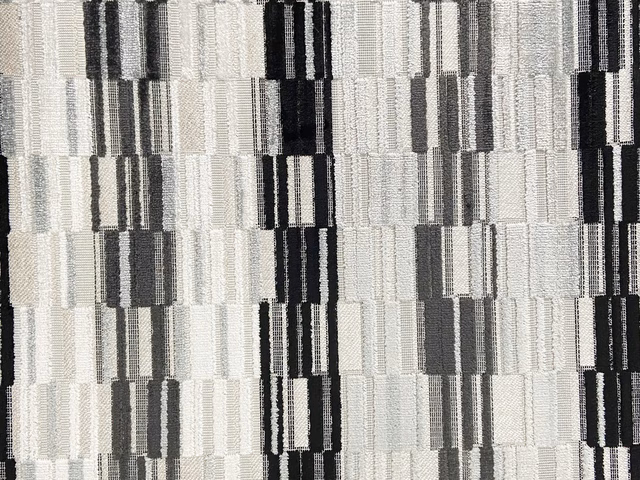 Cool grey velvet with black, white and charcoal geometric vertical blocks