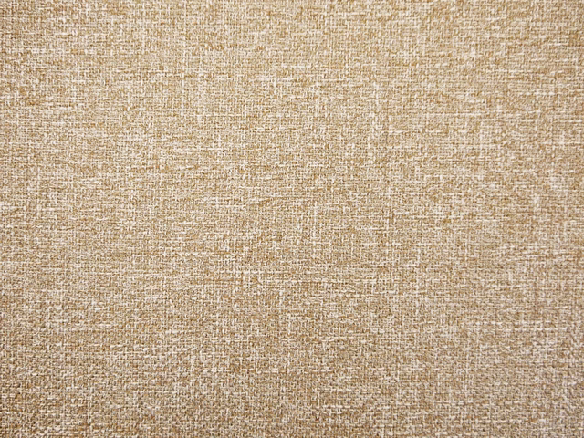 Warm oatmeal-beige chenille with a close, flecked woven surface