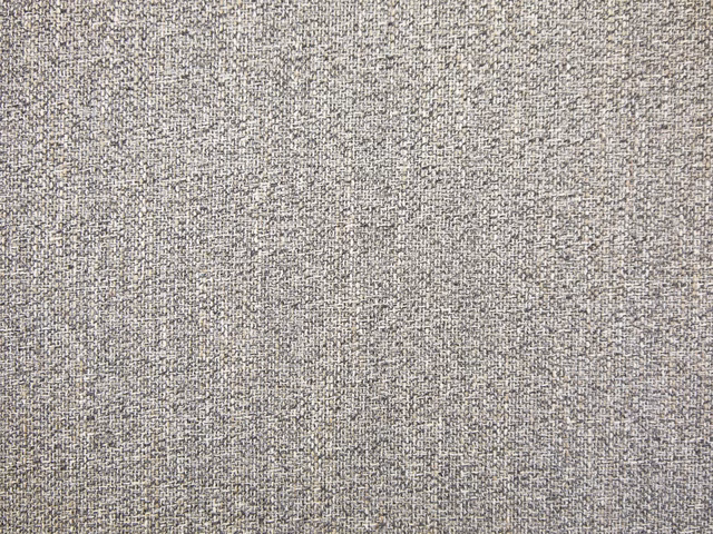 Warm stone-grey chenille with fine peppered flecks and a softly mottled weave