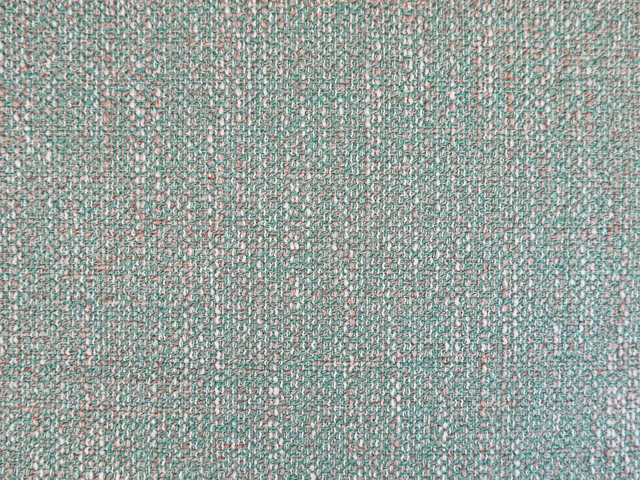 Close-up of muted teal chenille with pink, ivory and sage flecks