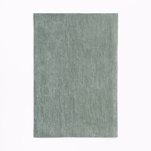 Muted celadon chenille swatch with fine vertical nap and softly mottled texture