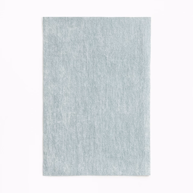 Pale glacier-blue chenille with a softly mottled, vertical textured surface