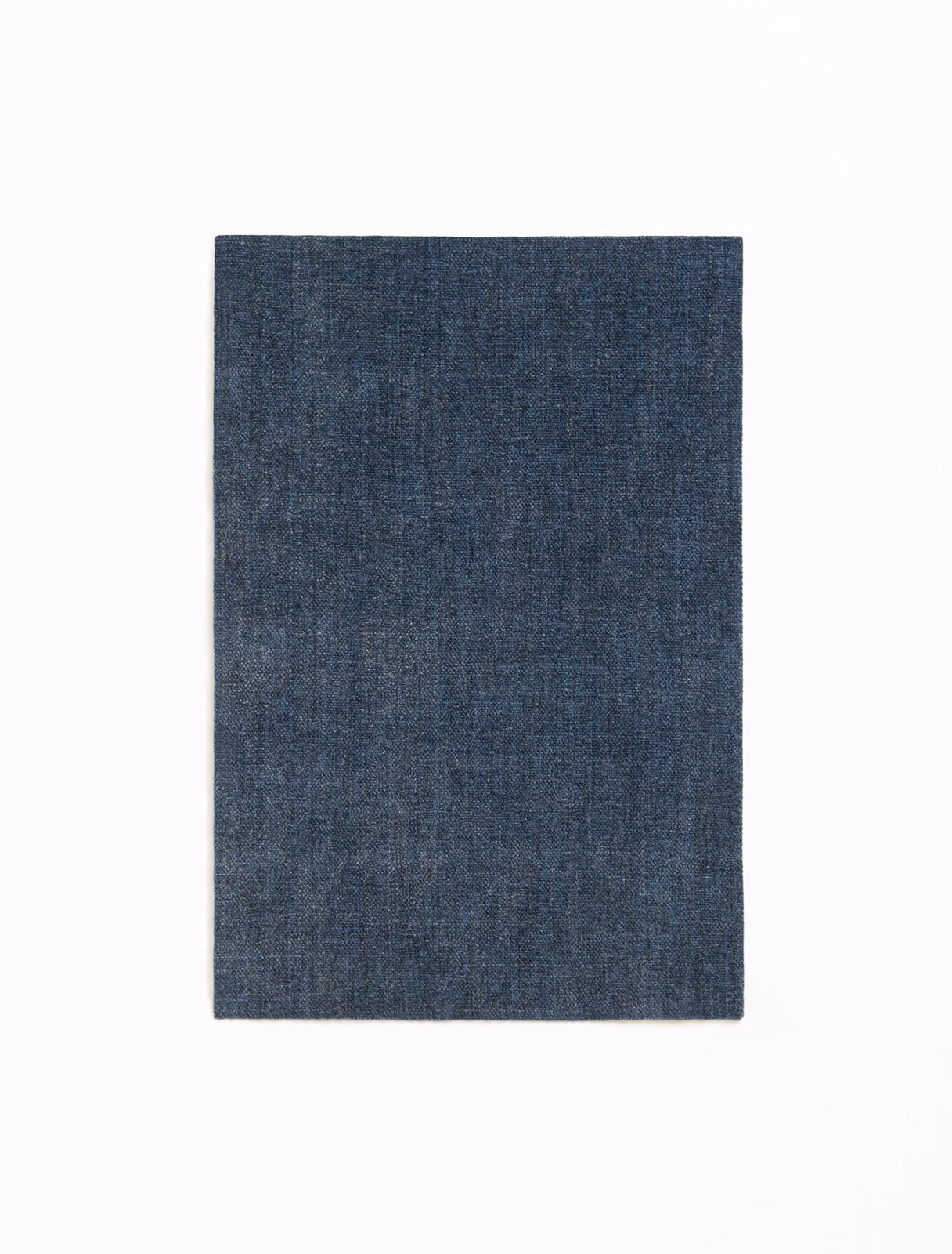 Deep indigo chenille swatch with subtle vertical grain and softly mottled shading