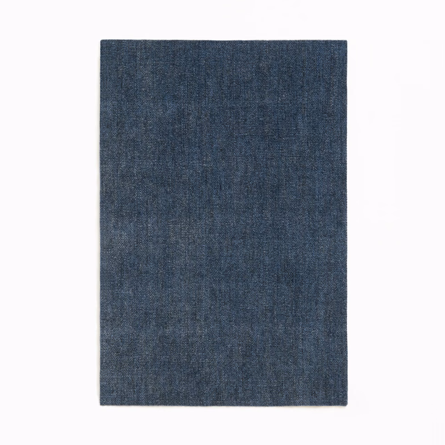 Deep indigo chenille swatch with subtle vertical grain and softly mottled shading