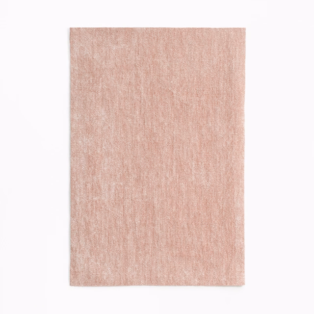 Pale dusty blush-pink chenille swatch with subtle vertical nap and mottled shading