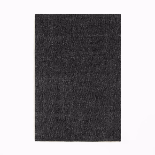 Near-black charcoal chenille swatch with fine vertical striations and softly mottled texture
