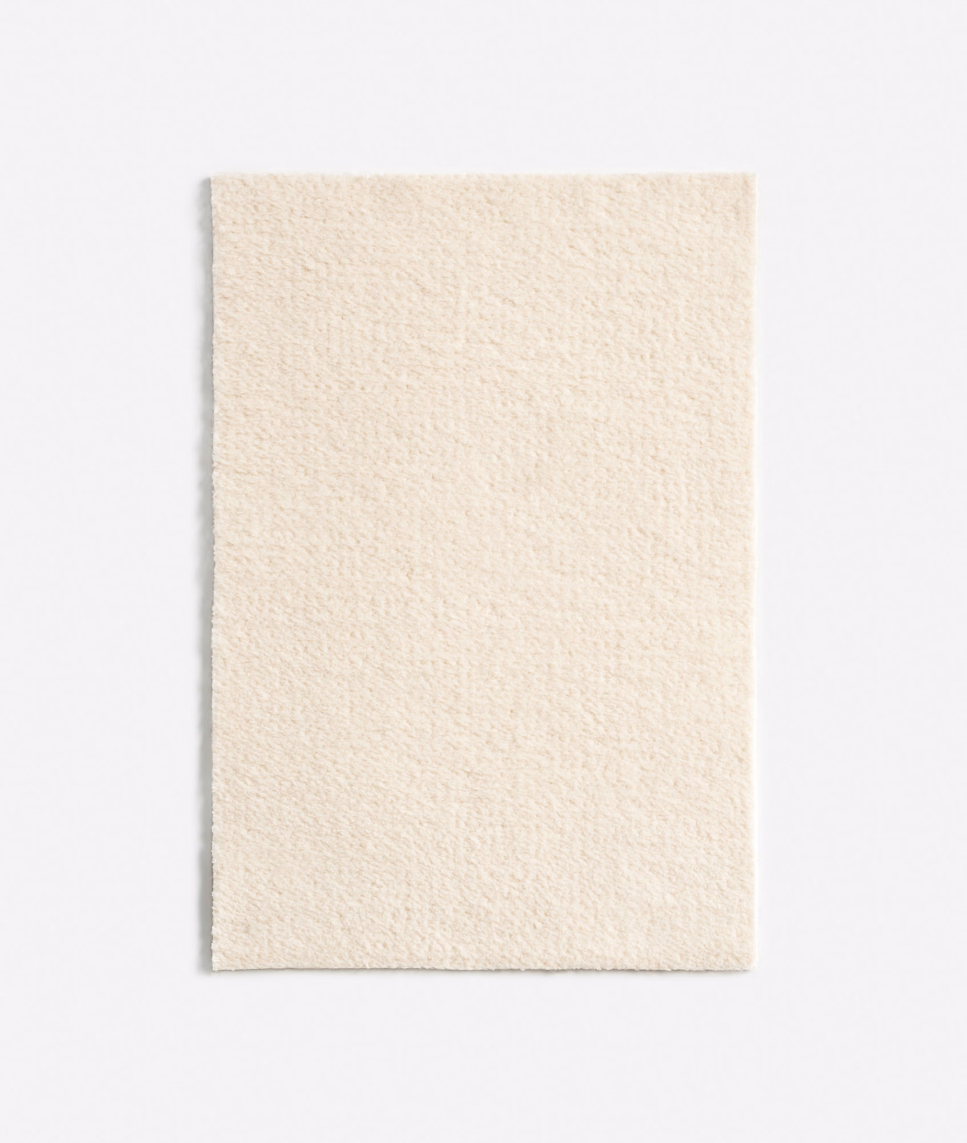 Warm ivory chenille swatch with a fine nubby weave and subtle vertical texture