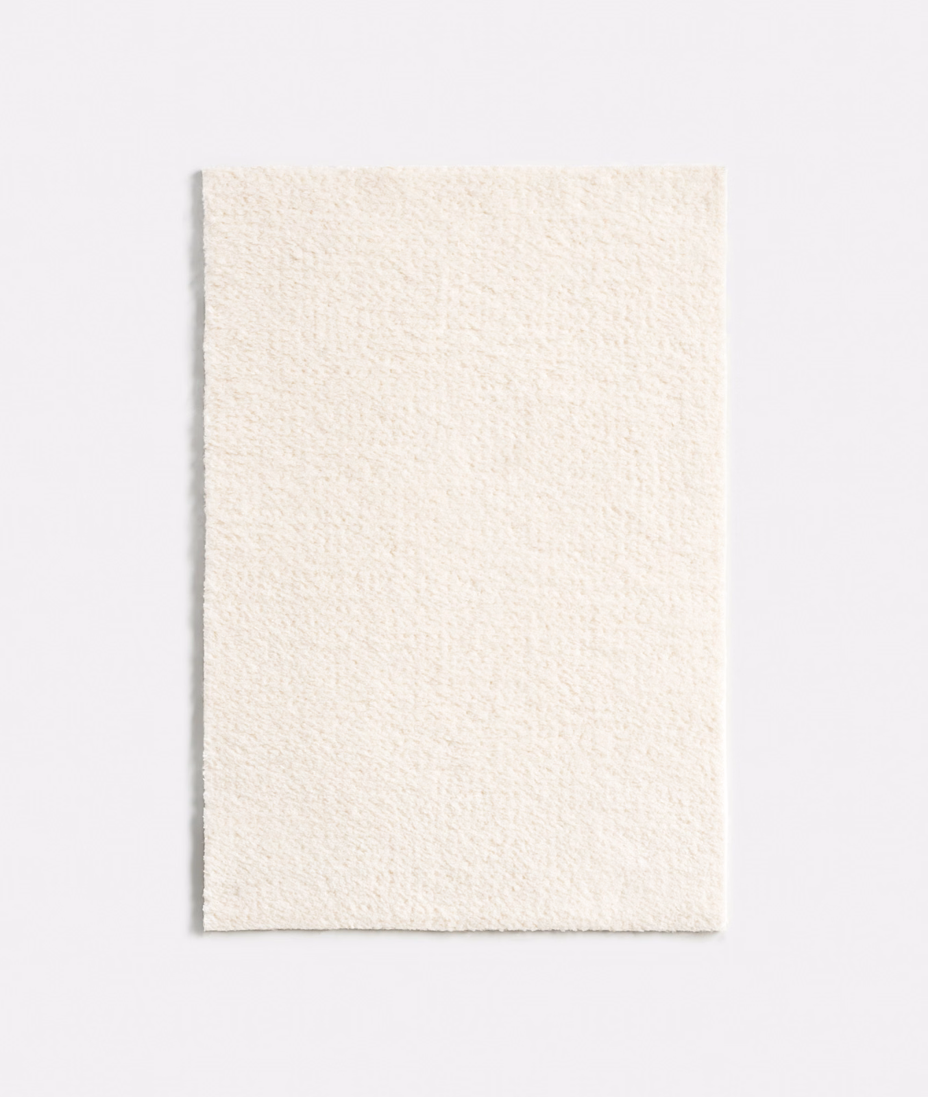 Close-up of snow-white chenille with a softly nubby, low-contrast surface
