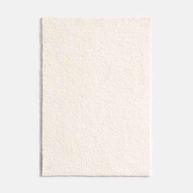 Close-up of snow-white chenille with a softly nubby, low-contrast surface