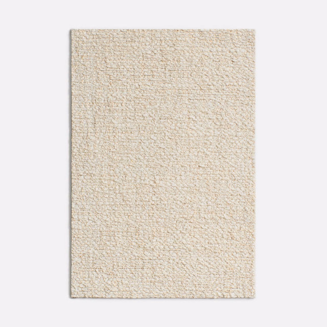 Warm magnolia cream chenille swatch with a nubby, subtly flecked woven surface