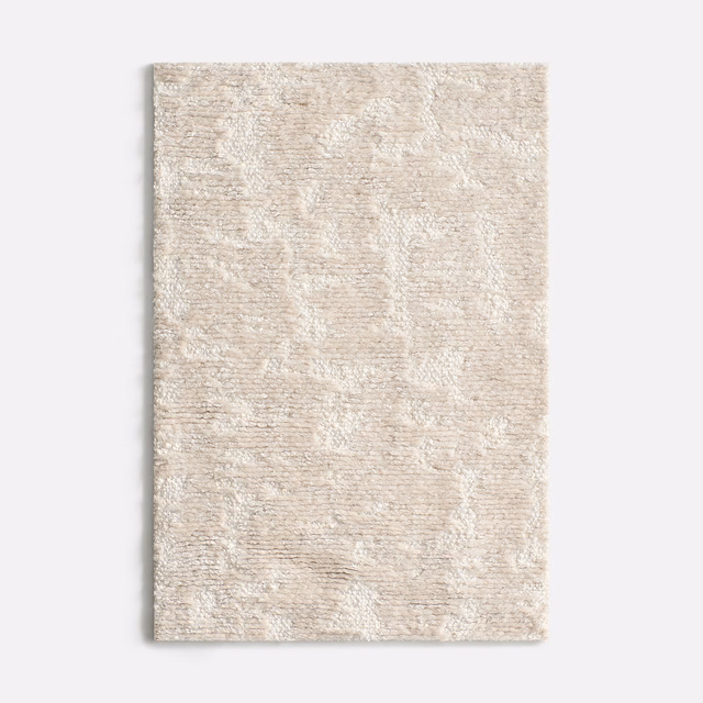 Pale blush chenille with mottled ivory-beige texture and softly rippled tonal pattern