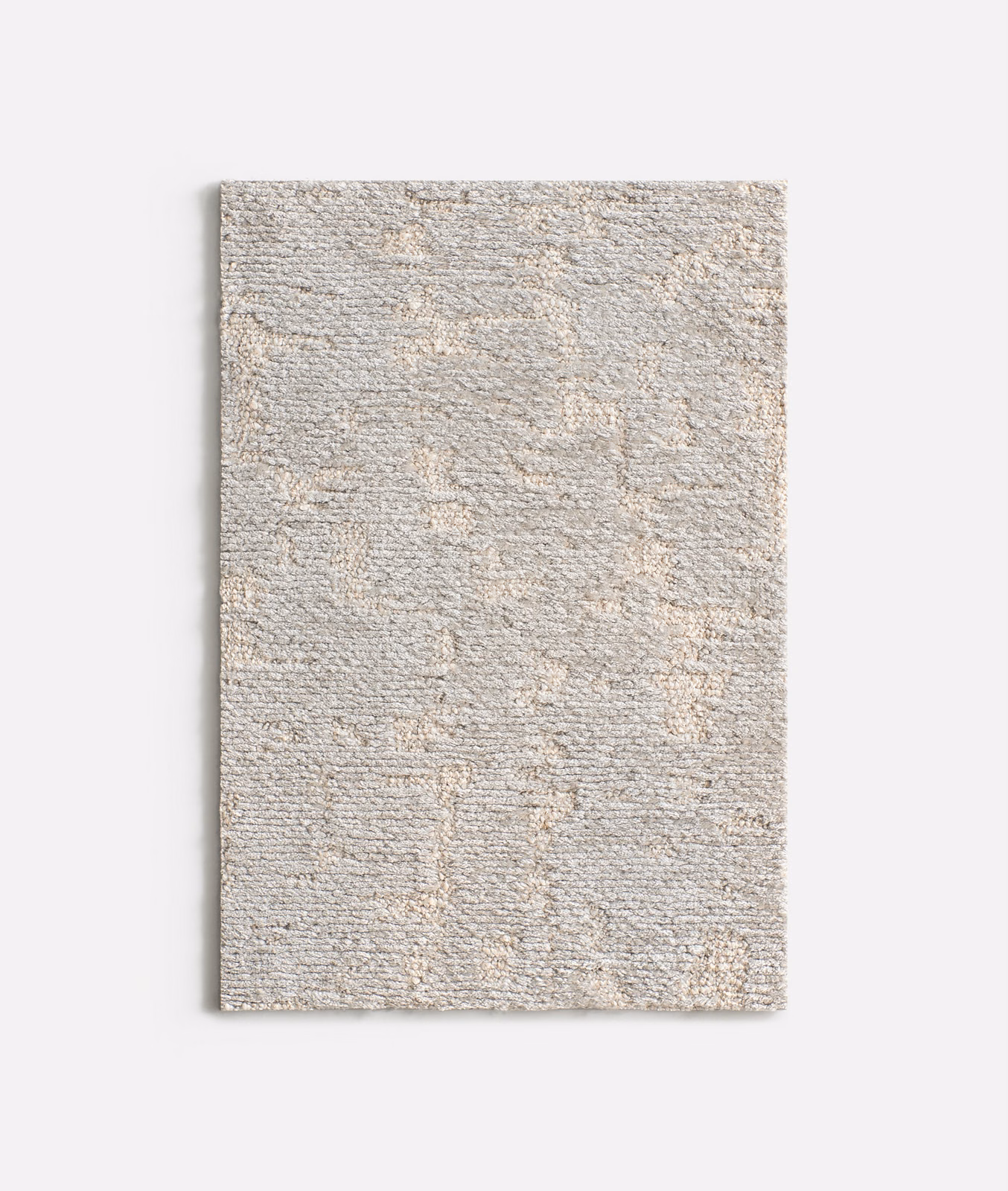 Pale greige chenille swatch with ivory flecks and irregular woven geometric texture