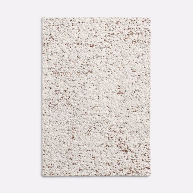 Warm ivory chenille swatch with dusty blush flecks and raised nubby texture