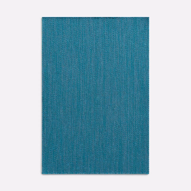 Cool teal denim-blue curtain fabric with a fine crosshatched plain weave