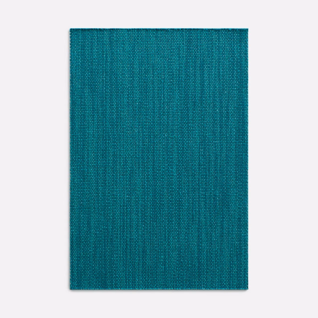 Deep lagoon teal fabric with fine vertical weave and subtly mottled blue-green texture