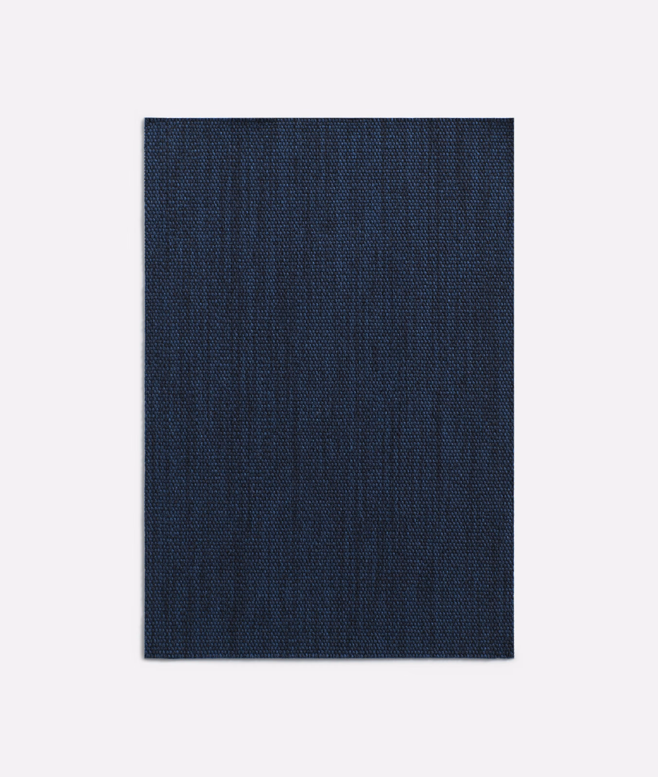 Deep navy woven curtain fabric with subtle vertical striations and fine texture