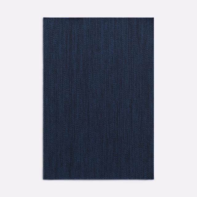 Deep navy woven curtain fabric with subtle vertical striations and fine texture