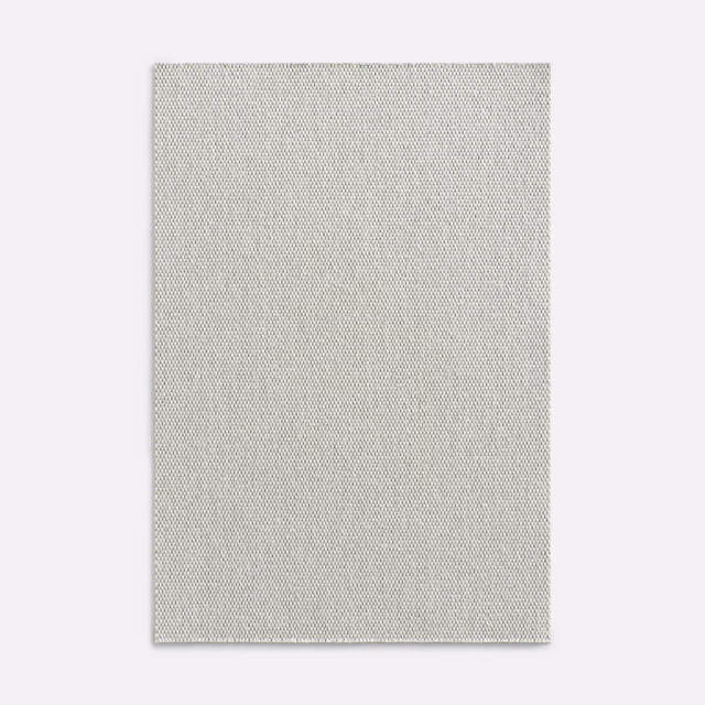 Pale pearl-grey curtain textile with a fine, closely spaced diagonal weave
