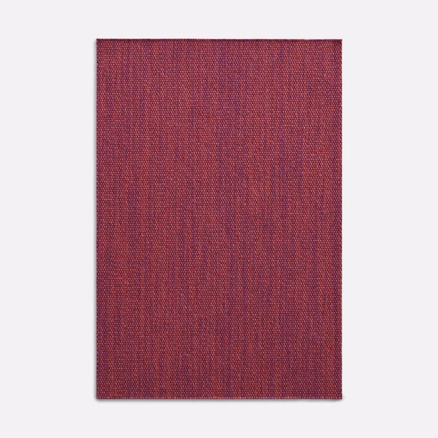 Deep rose-red woven fabric swatch with fine vertical striations and subtly mottled texture
