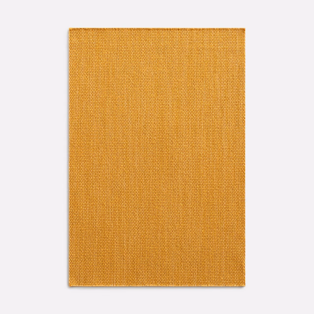 Saffron-gold woven textile swatch showing a fine, even surface grain