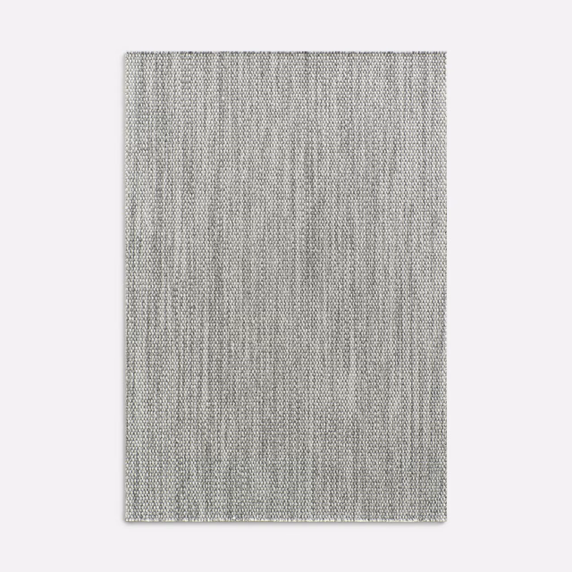 Soft cool-grey woven curtain fabric with fine, irregular vertical striations
