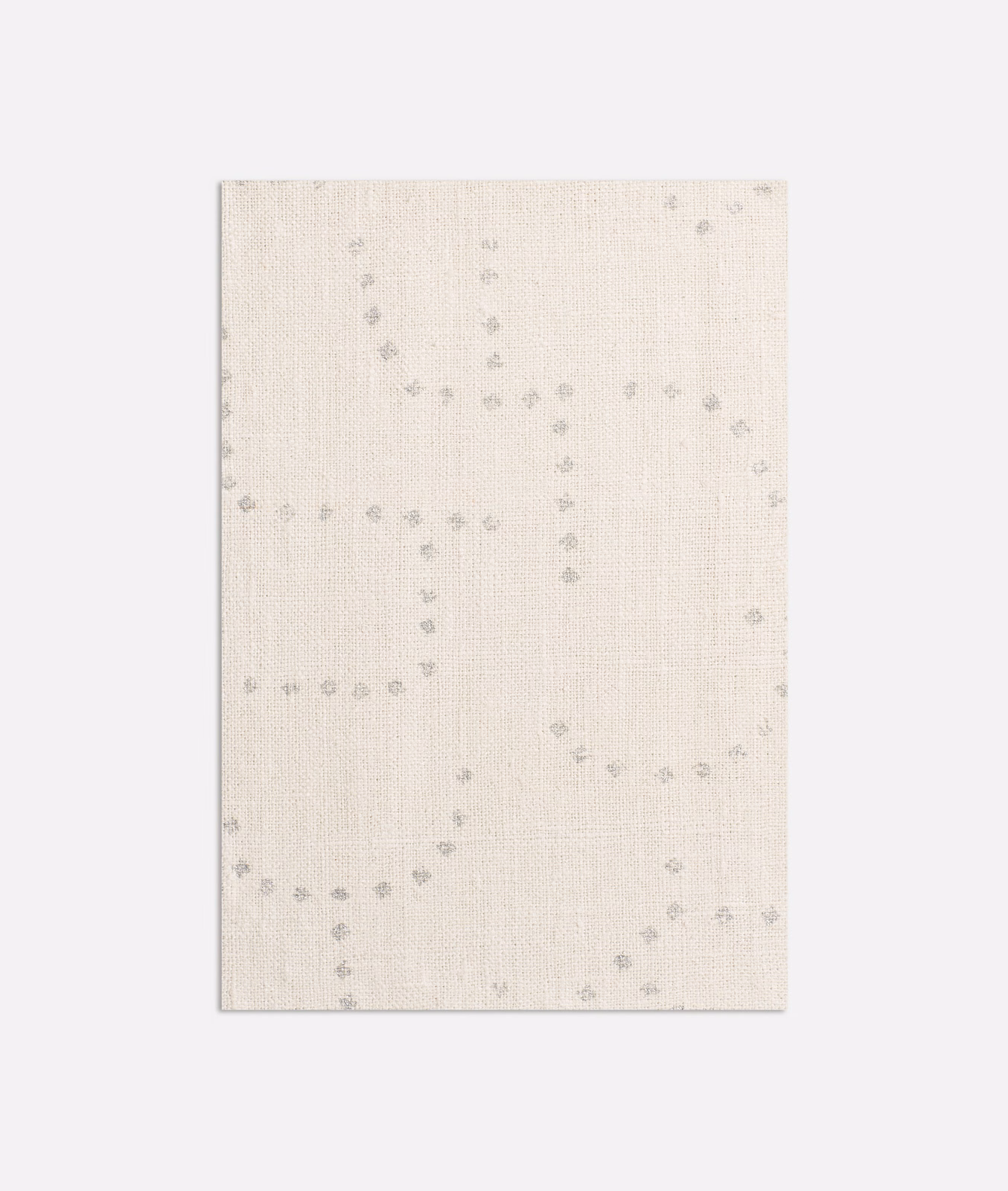 Pale ivory woven cloth with cool-grey dotted loops and a softly textured surface