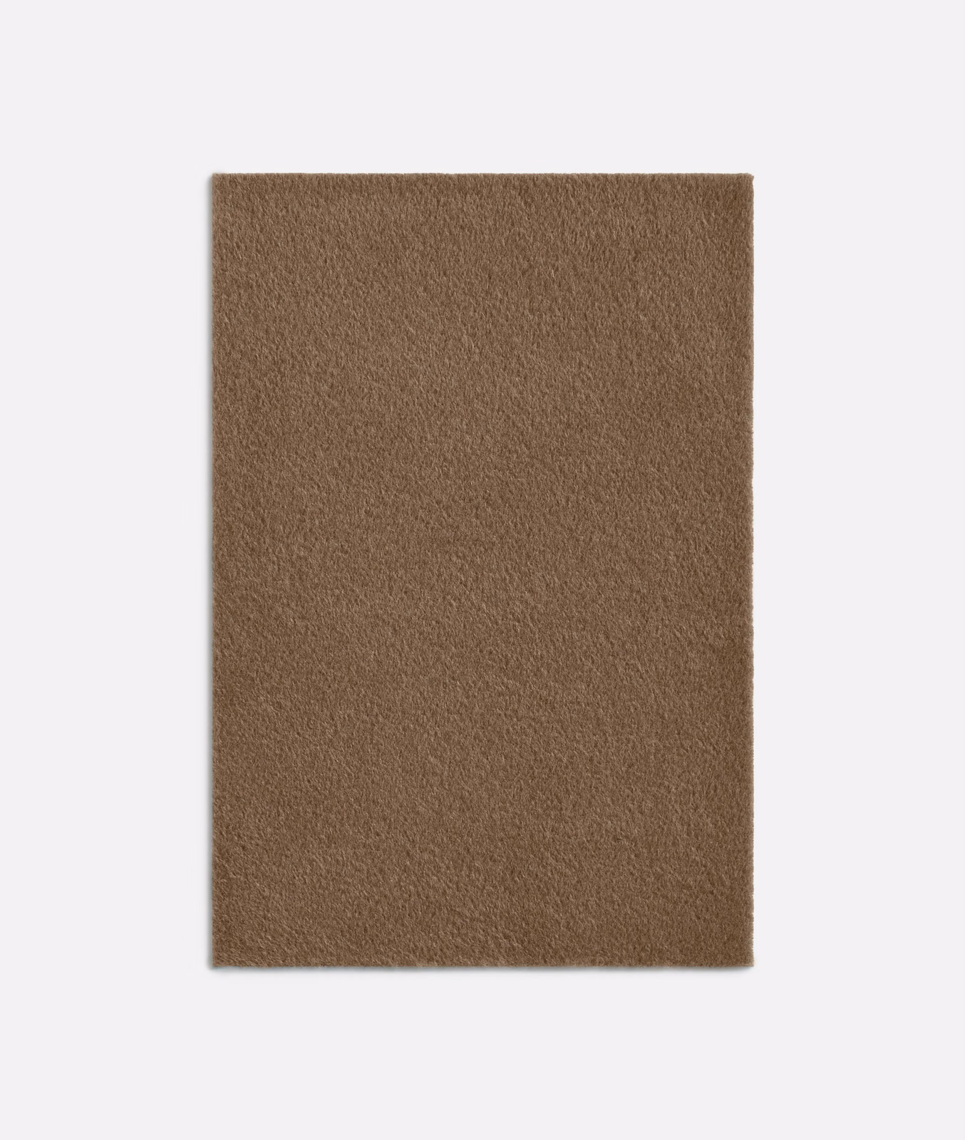 Close swatch of warm camel-brown fabric with a soft, densely brushed alpaca-like texture