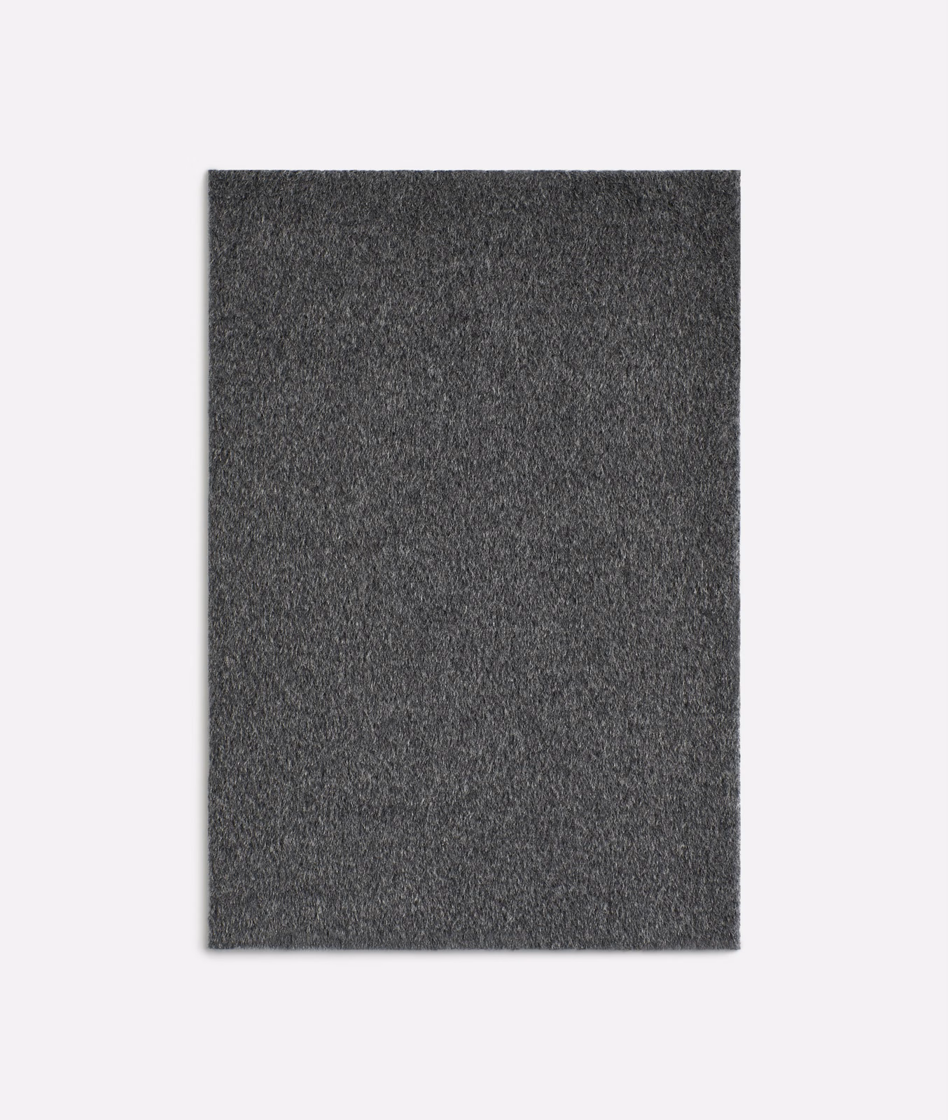Dark charcoal-grey fuzzy weave with softly mottled texture and a matte finish