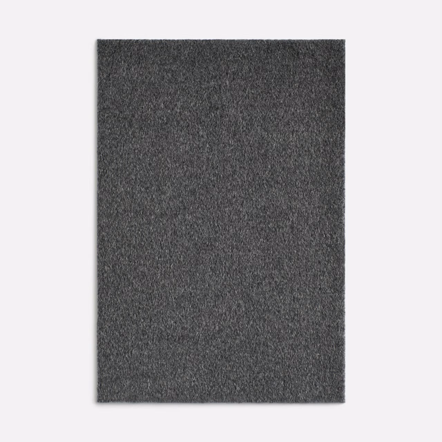 Dark charcoal-grey fuzzy weave with softly mottled texture and a matte finish