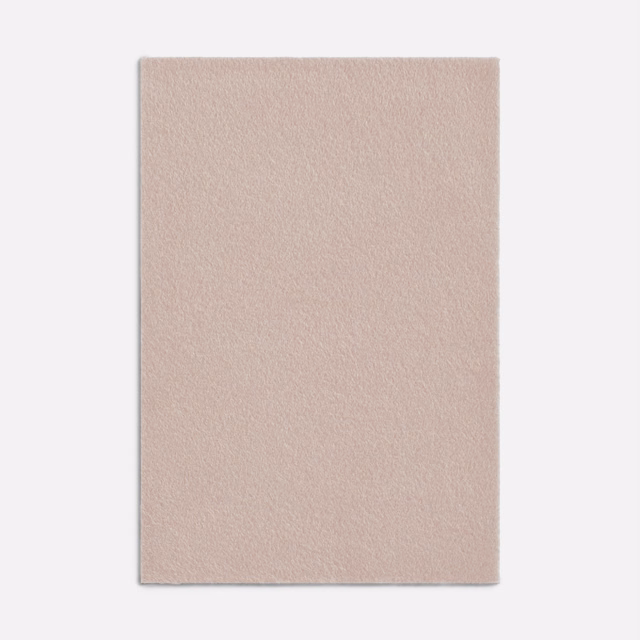Warm blush-nude plain textile with a softly brushed, even surface
