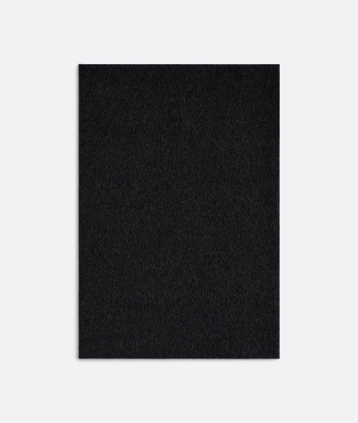Near-black brushed textile with subtle charcoal texture and softly irregular surface