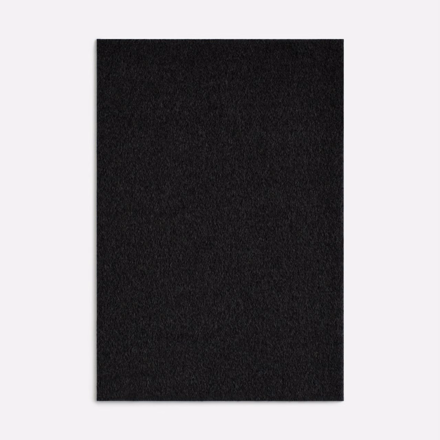 Near-black brushed textile with subtle charcoal texture and softly irregular surface