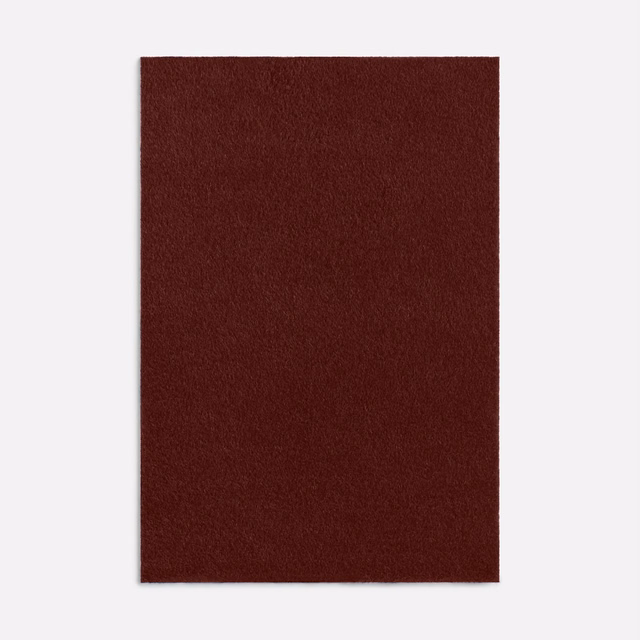 Deep oxblood-red fabric swatch with softly brushed, low-sheen texture
