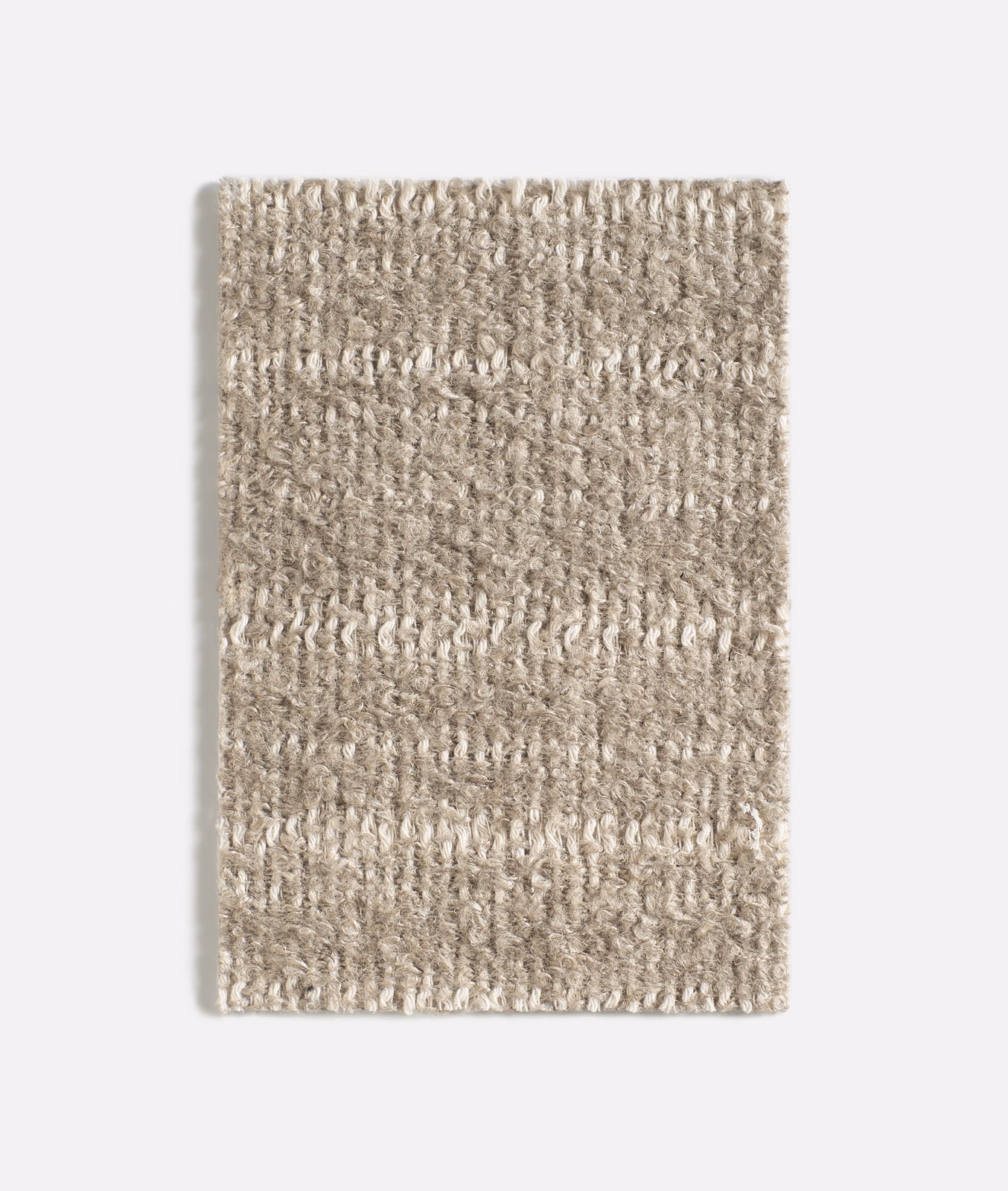 Warm taupe-beige swatch with irregular vertical loops and softly flecked texture
