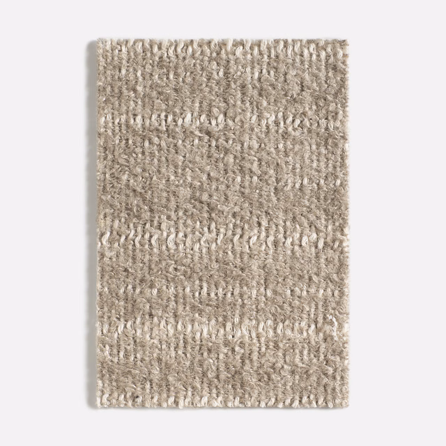 Warm taupe-beige swatch with irregular vertical loops and softly flecked texture