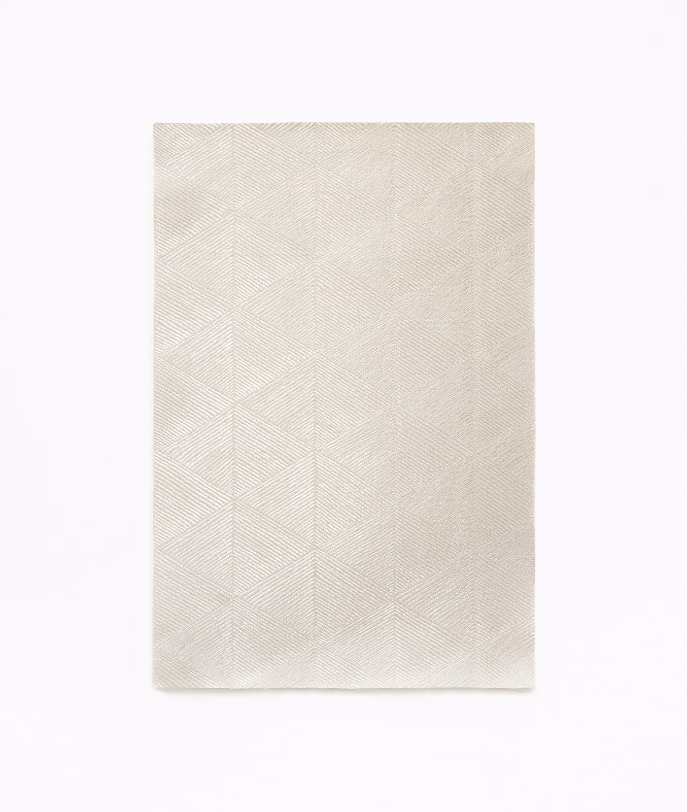 Pale ivory curtain fabric with fine chevron-like geometric woven texture