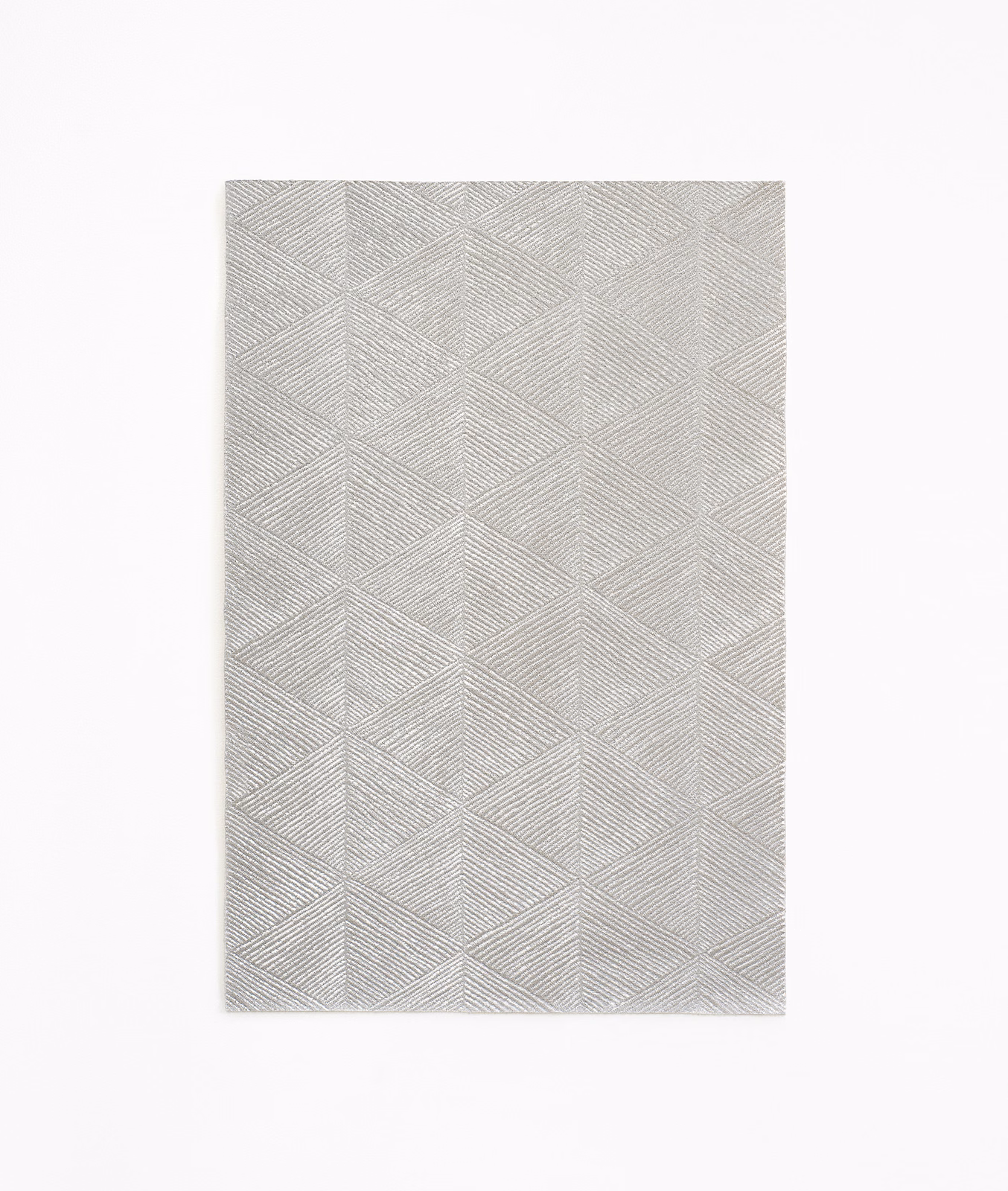 Cool silver-grey fabric with fine chevron lines forming repeating angular panels