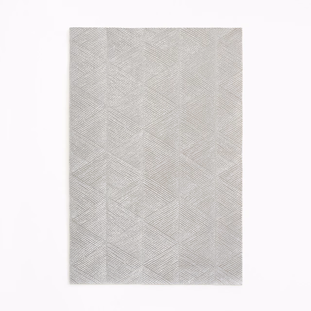 Cool silver-grey fabric with fine chevron lines forming repeating angular panels
