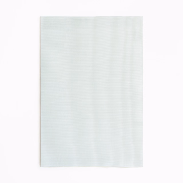 Pale aqua curtain swatch with faint vertical striations and a cool, airy finish