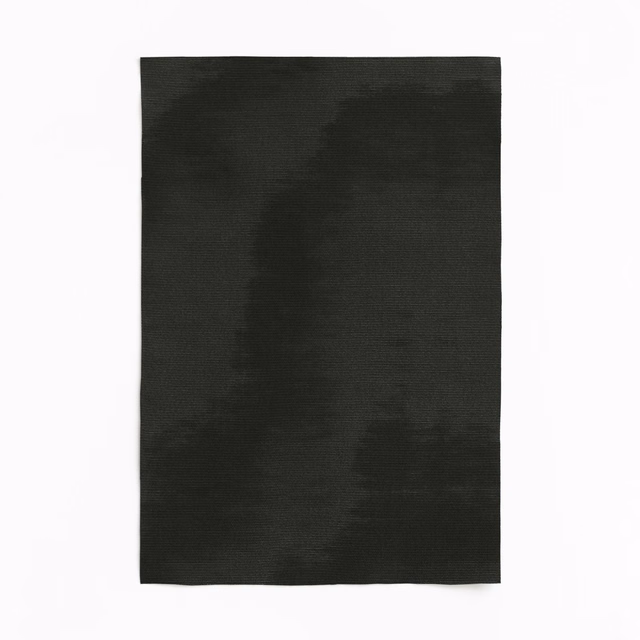 Deep anthracite curtain fabric with soft, shadowy tonal bands and a fine woven surface