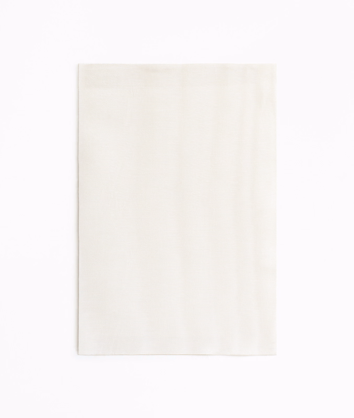 Soft ivory curtain fabric swatch with barely visible vertical tonal movement