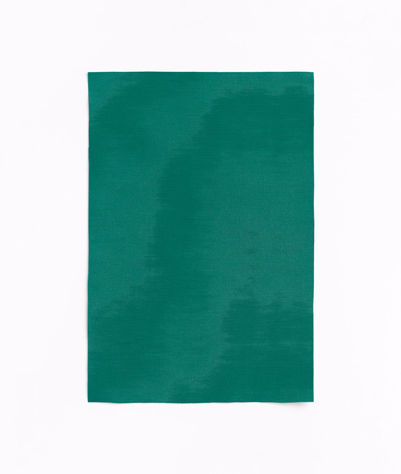 Deep chlorophyll green curtain fabric with subtle horizontal weave and tonal surface variation